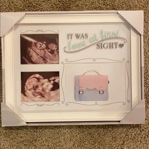 White baby frame with three inserts